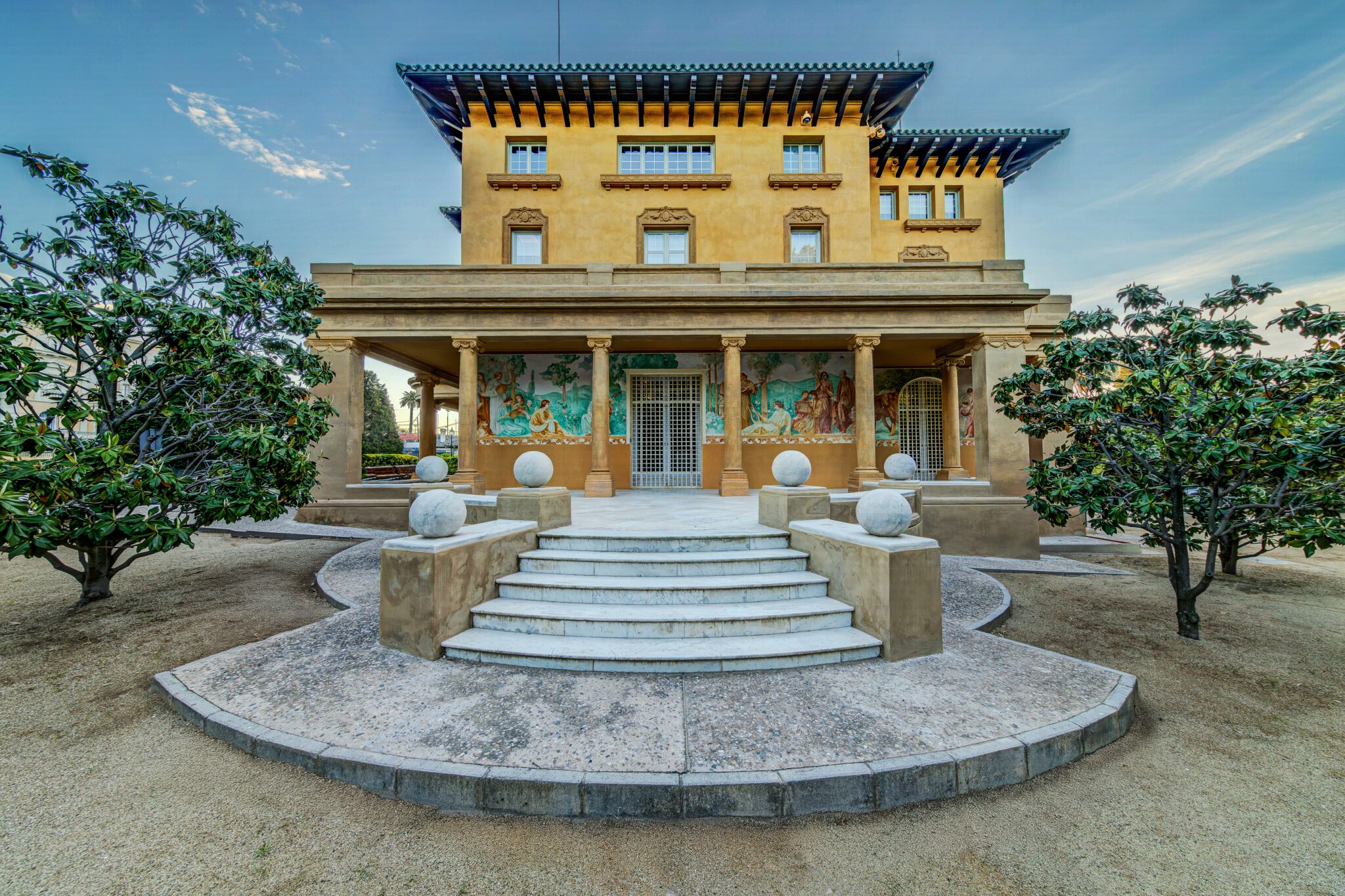 The garden façade of the historic U.S. Consulate General Barcelona, historically known as Torre Godó Equia after exterior restoration. Noted Catalan architect Enric Sagnier (1858-1931) designed the building, and it was constructed in 1914. U.S. Consulate Barcelona